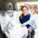 Woman putting the Cool 'N Cover Car Seat Heat Shield and Sun Shade on a car seat in the vehicle