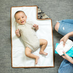 Full Body Changing Pad, camo unfolded with baby laying on it