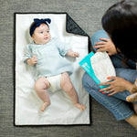 Disney Baby Full Body Changing Pad, Mickey Black unfolded with baby on it