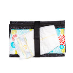 Disney Baby Full Body Changing Pad, Mickey Black folded with diaper and wipes in strap