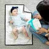 Disney Baby Full Body Changing Pad Mickey Minnie Ivory unfolded with baby laying on it