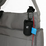 The Bag ‘N Bags Bag Dispenser is a fabric, duffle-style dispenser that conveniently holds 1 roll of 15 disposable bags that are perfect to hide all evidence of dirty diapers, messy bibs, wet clothing, and more.