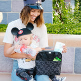 Woman sitting with baby holding Disney Baby MaxiCOOL Four Bottle Cooler, Mickey Black