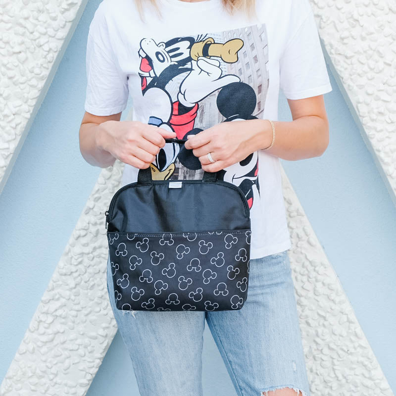 Woman holding Disney Baby MaxiCOOL Four Bottle Cooler, Mickey Black