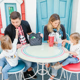 Family sitting at table with Disney Baby MaxiCOOL Four Bottle Cooler, Mickey Black