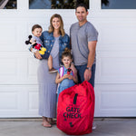 Family standing next to the Disney Baby Gate Check Travel Bag for Car Seats