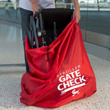 Man putting stroller in the Gate Check Travel Bag for Single and Double Strollers