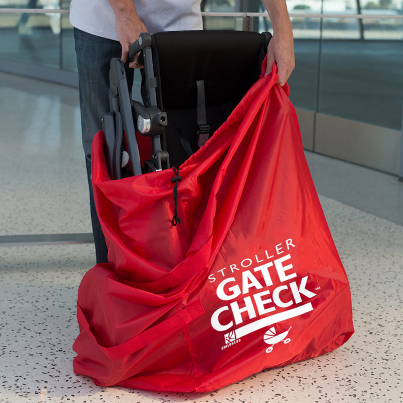 Man putting stroller in the Gate Check Travel Bag for Single and Double Strollers