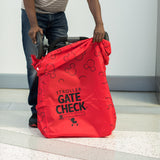 Man putting stroller in the Disney Baby Gate Check Travel Bag for Standard and Double Strollers