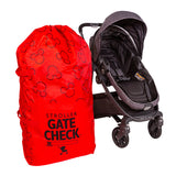 Disney Baby Gate Check Travel Bag for Standard and Double Strollers sitting next to stroller