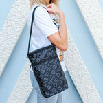 Woman carrying Disney Baby 6 Bottle Cooler, Mickey Black by shoulder strap