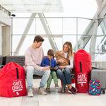 Family sitting next to the Gate Check Travel Bag for Umbrella Strollers and Gate Check Travel Bag for Car Seats