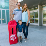 Family standing next to the Gate Check Travel Bag for Umbrella Strollers