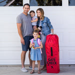 Family standing next to the Disney Baby Gate Check Travel Bag for Umbrella Strollers