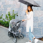 Woman pushing stroller with Disney Baby Universal Stroller Weather Shield on it