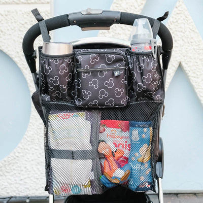 Disney Baby Cups ‘N Cargo Stroller Organizer hanging on stroller with accessories in it
