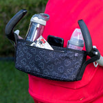 Disney Baby Universal Stroller Organizer hanging on stroller with accessories in it