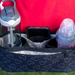 close up picture of Disney Baby Universal Stroller Organizer with accessories in it